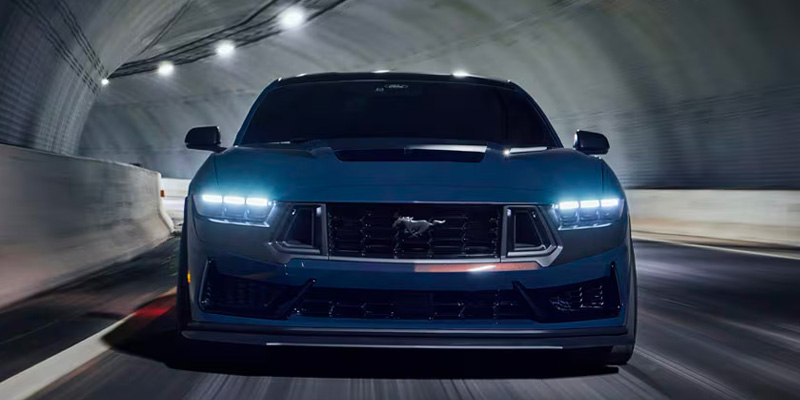 a 2025 Ford Mustang driving through a tunnel road